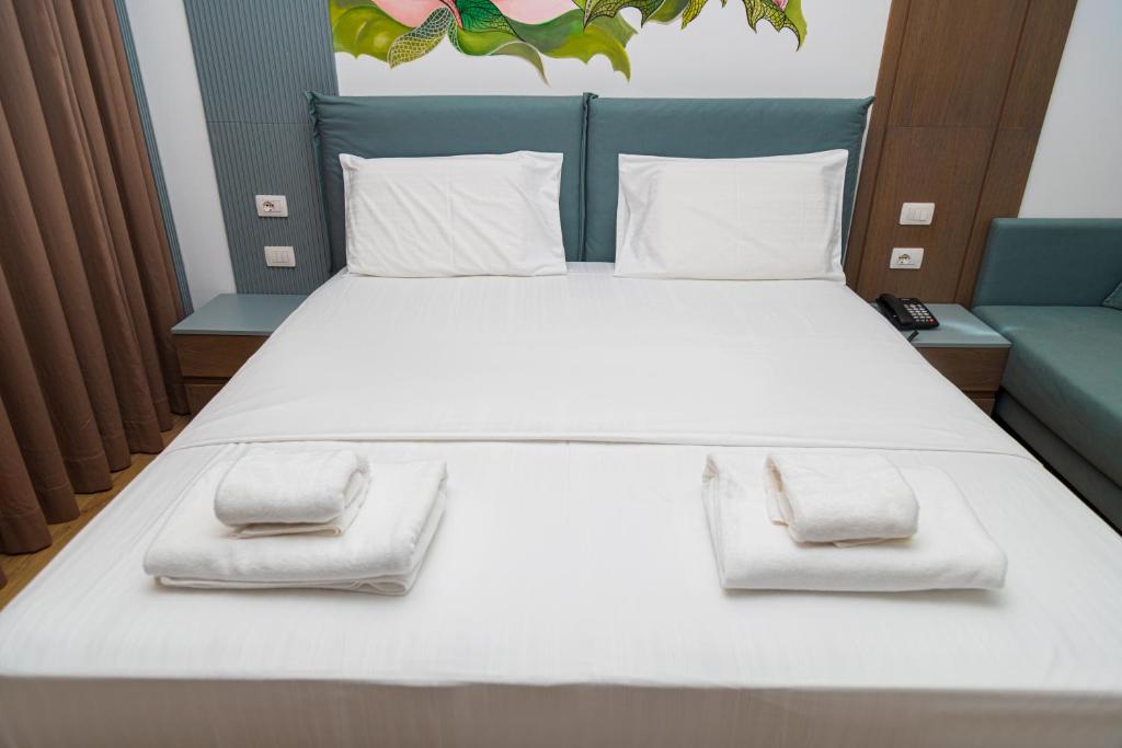 Postel nebo postele na pokoji v ubytování Solis Giselle Hotel