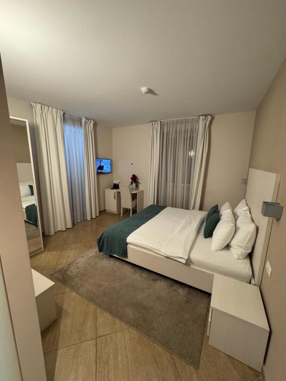 Postel nebo postele na pokoji v ubytování Hotel Konavle