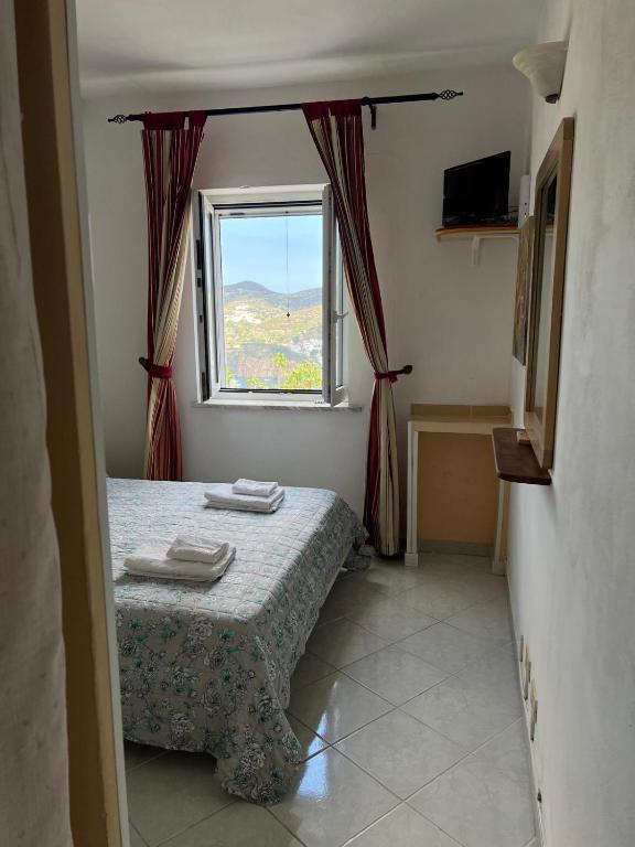 Postel nebo postele na pokoji v ubytování Villa Adele Ponza