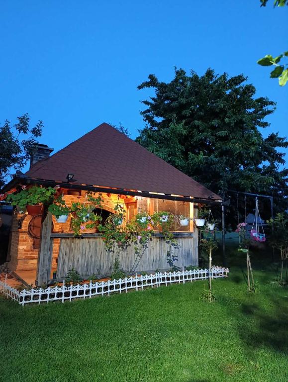 a house with a fence in the yard at Villa Majida Ilidža in Sarajevo