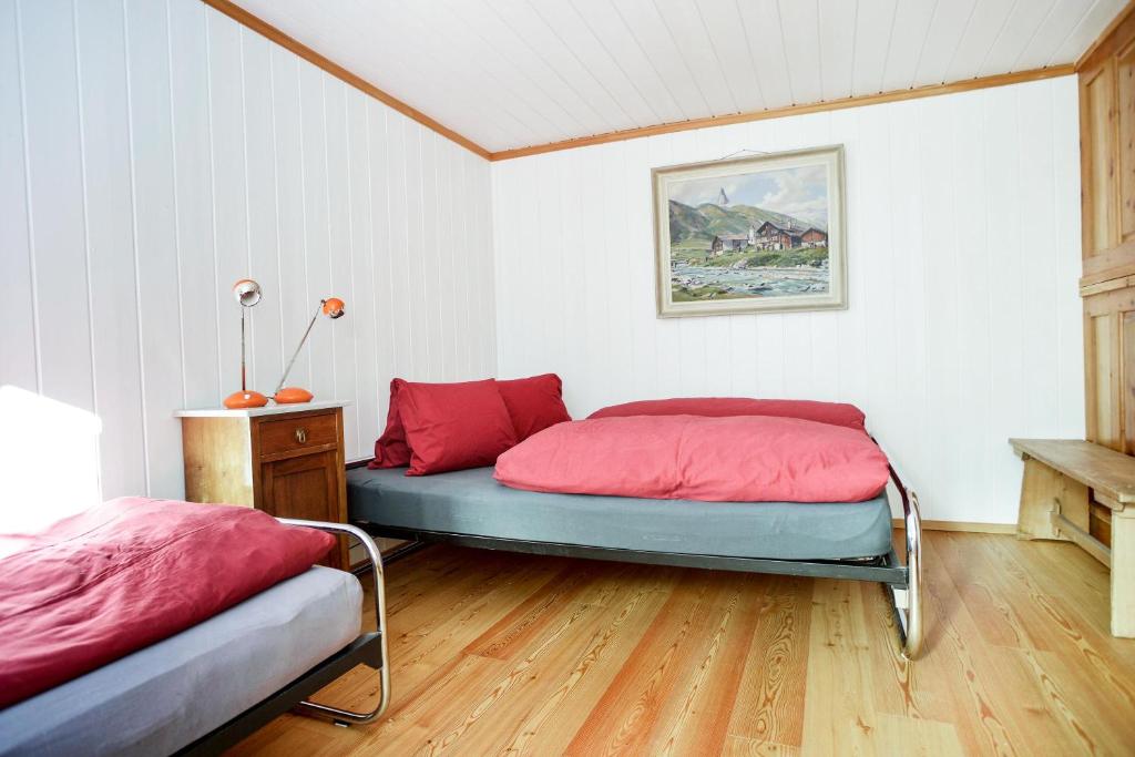 Postel nebo postele na pokoji v ubytování Grosshus Vals