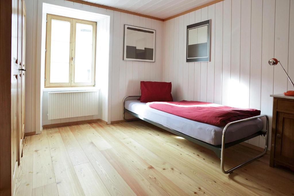Postel nebo postele na pokoji v ubytování Grosshus Vals