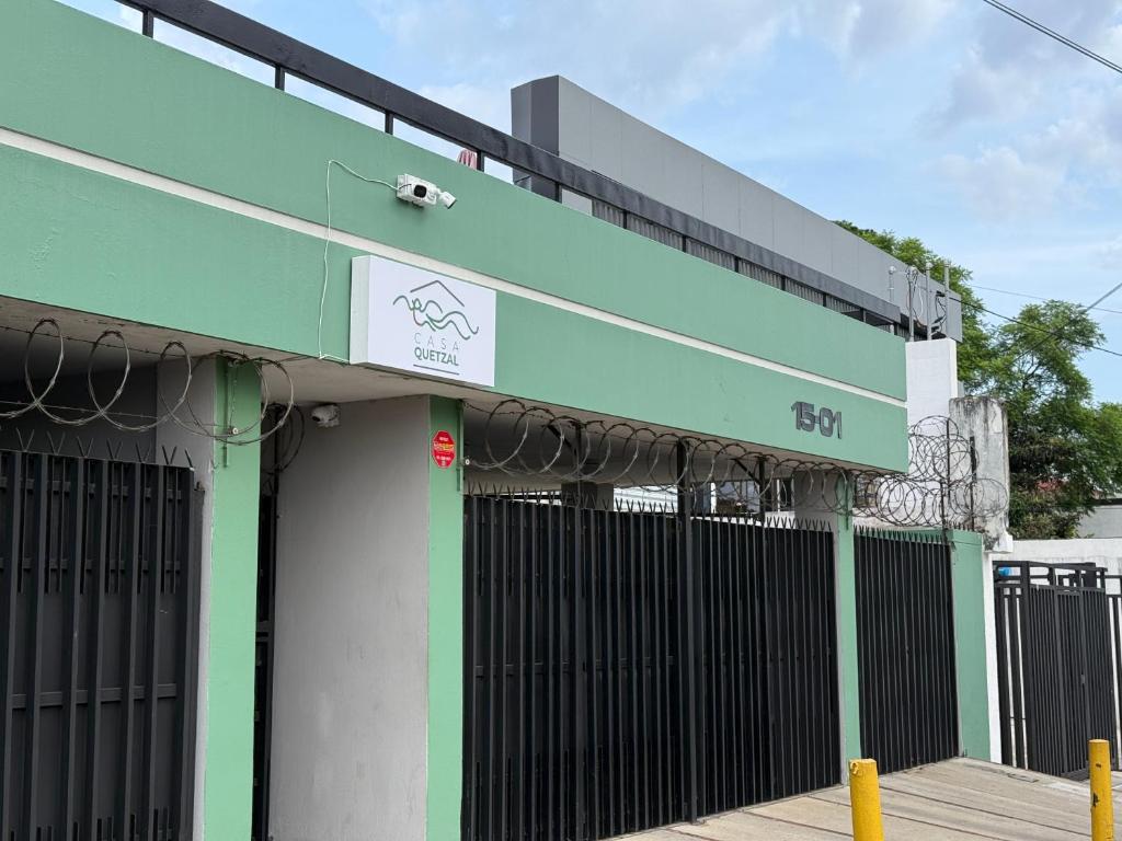 a building with a green and black fence at Casa Quetzal in Guatemala