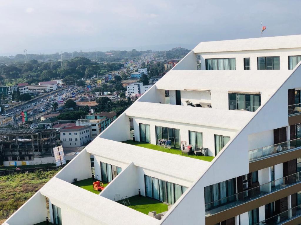 a series of buildings with a view of a city at RoyalRest at Signature CPG in Accra