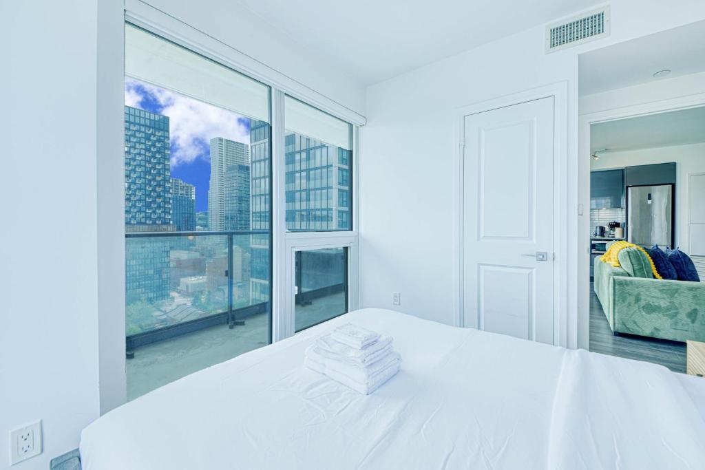 Letto o letti in una camera di RivetStays - The Jarvis