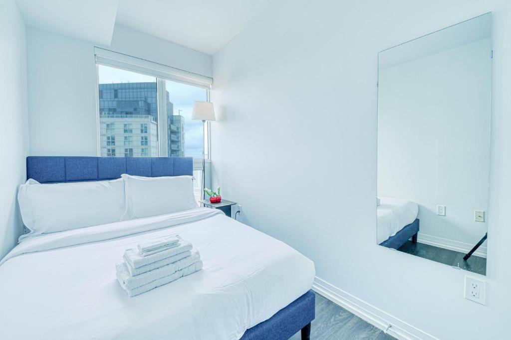 Letto o letti in una camera di RivetStays - The Jarvis