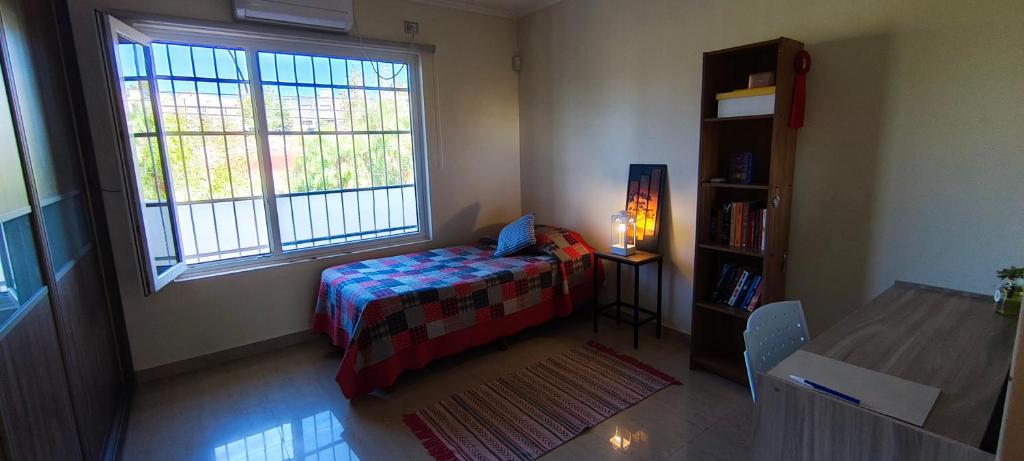 En eller flere senge i et værelse på Espacio Abriendo Caminos