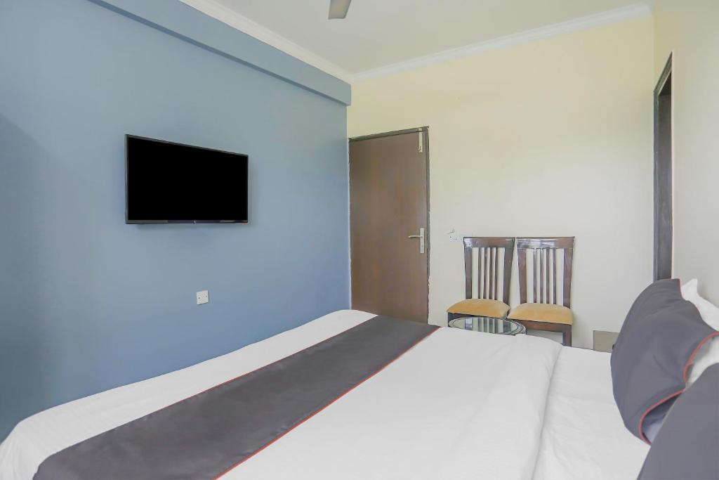 Postel nebo postele na pokoji v ubytování Townhouse Green Park Residency 1
