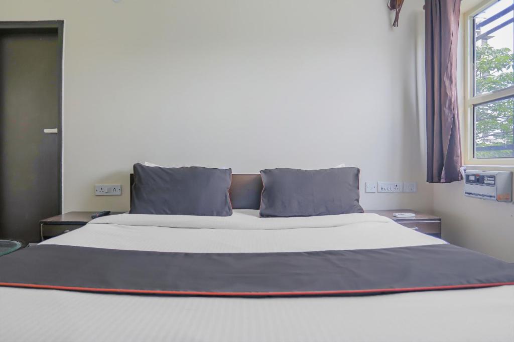 Postel nebo postele na pokoji v ubytování Townhouse Green Park Residency 1