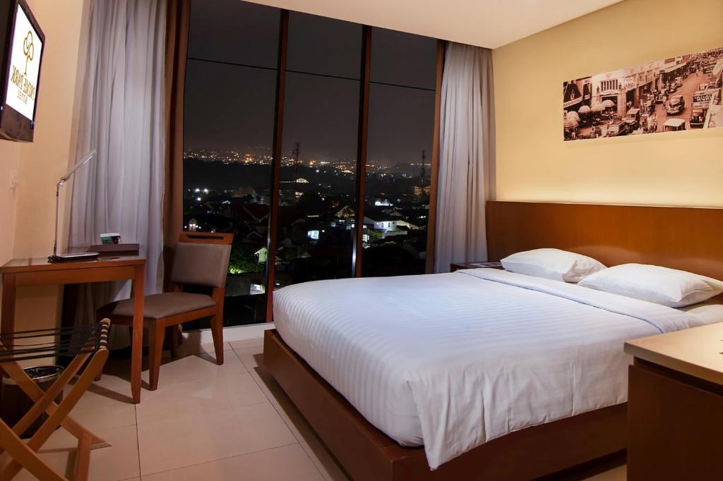 Postel nebo postele na pokoji v ubytování PRIME PARK Hotel Bandung