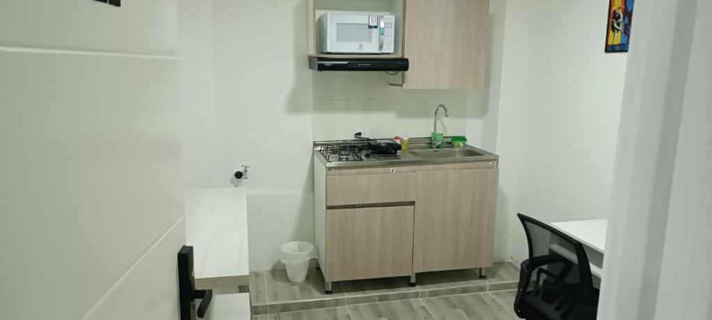 Kuchyň nebo kuchyňský kout v ubytování Rockhouse Apartaestudios