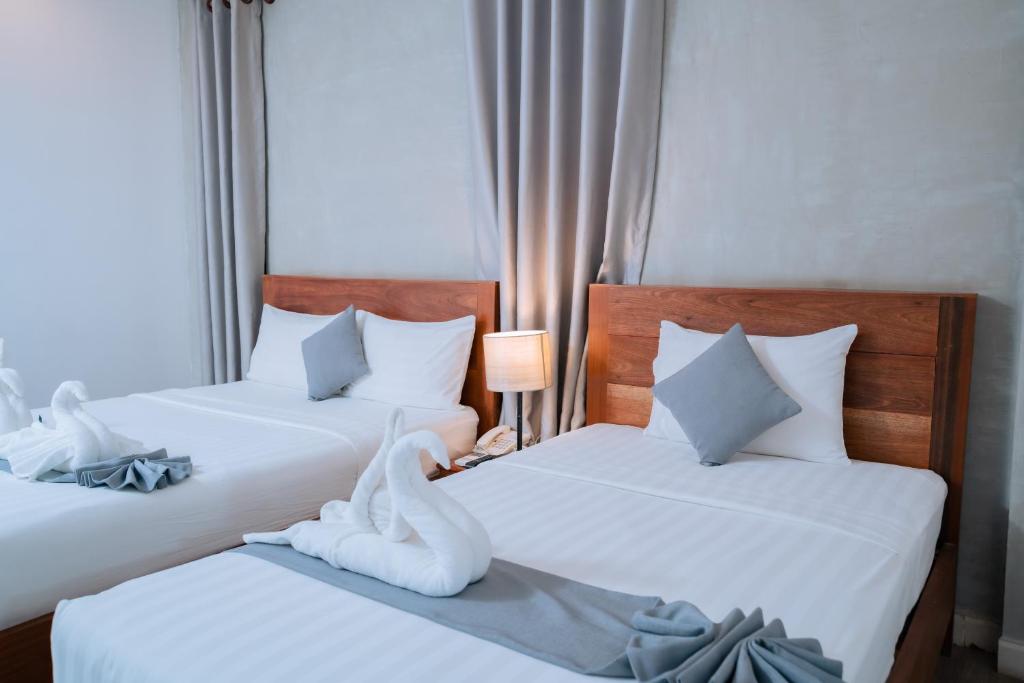 Postel nebo postele na pokoji v ubytování Home Chic Hotel