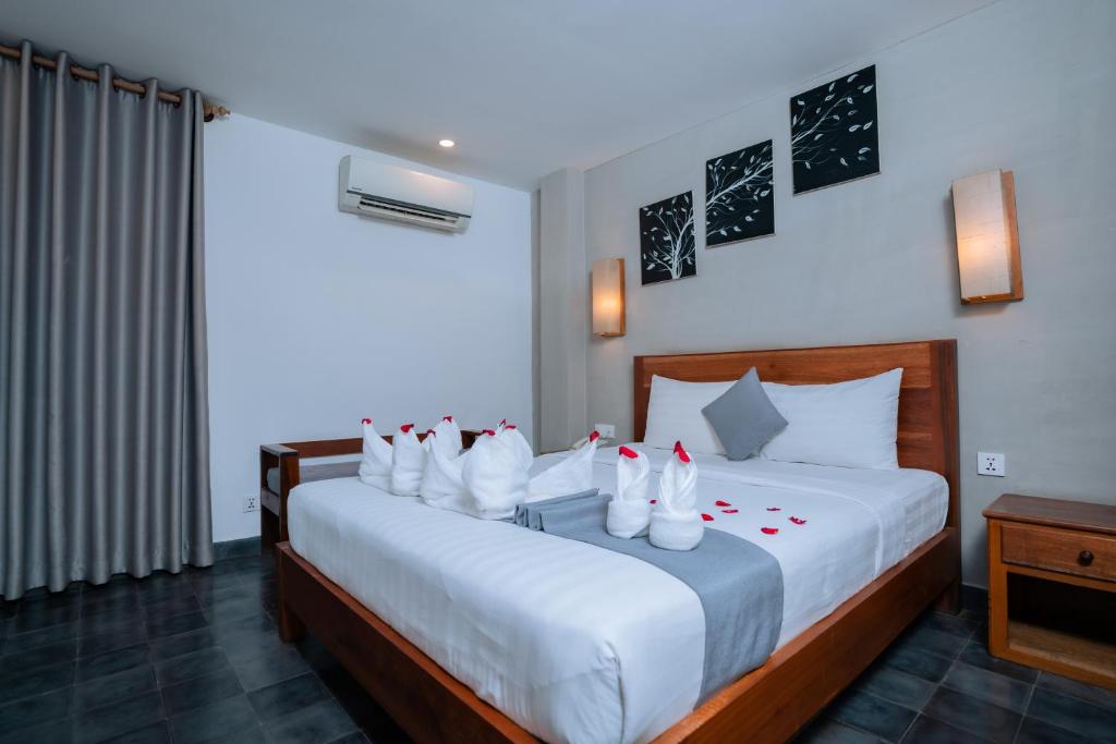 Postel nebo postele na pokoji v ubytování Home Chic Hotel