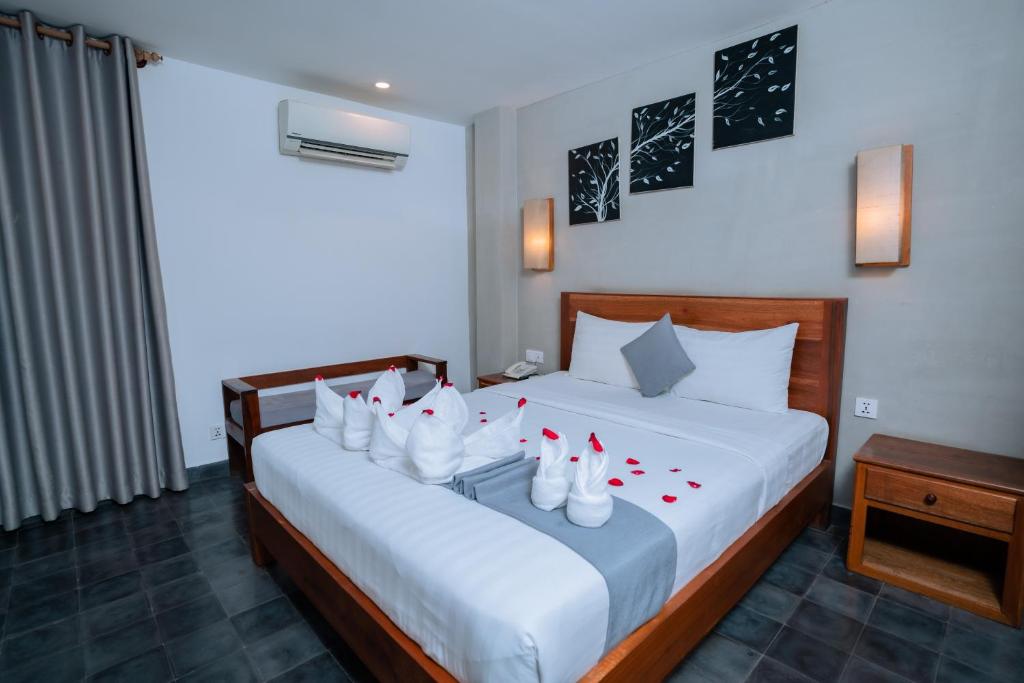 Postel nebo postele na pokoji v ubytování Home Chic Hotel
