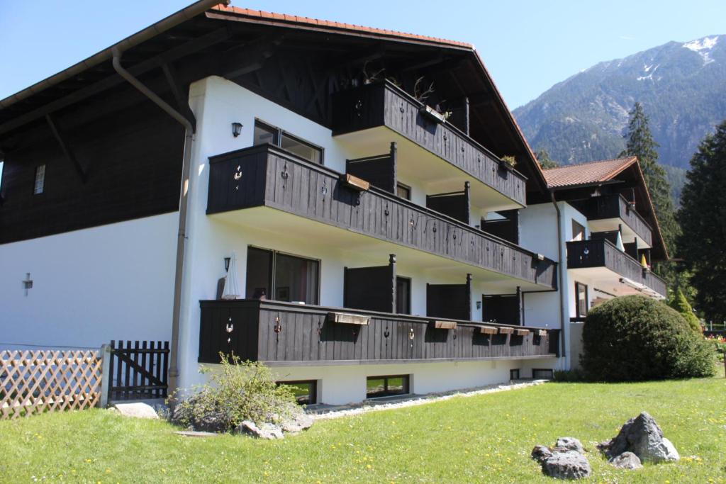 a building with balconies on the side of it at Apartment Zugspitz in Farchant