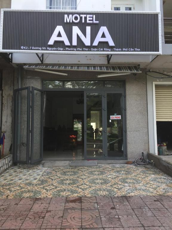 an entrance to a modern ama building with glass doors at Motel ANA in Cái Răng