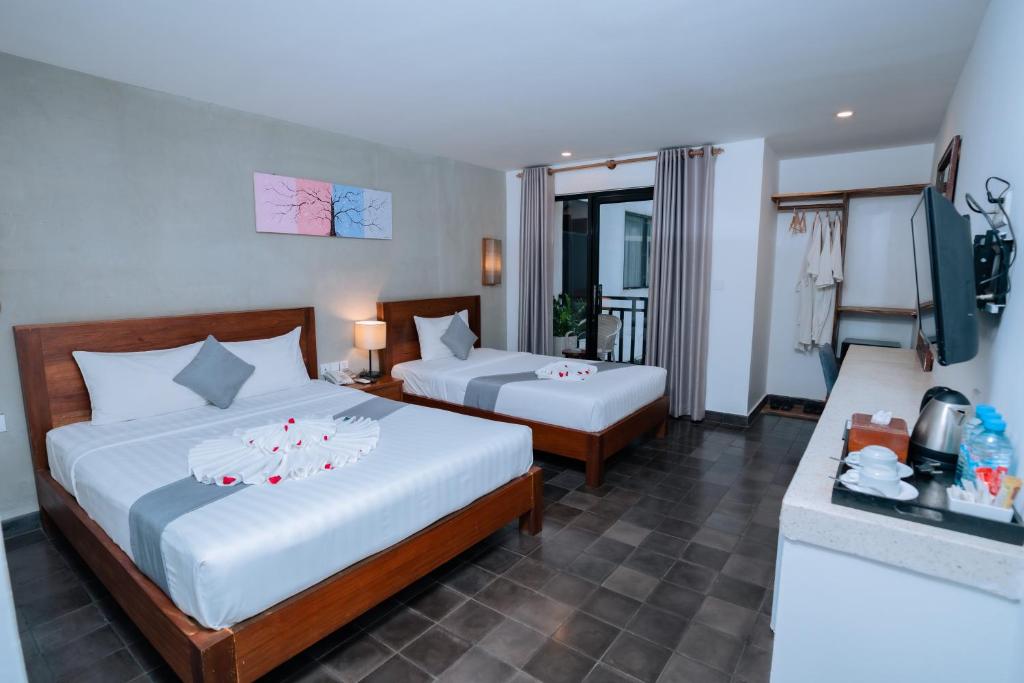 Postel nebo postele na pokoji v ubytování Home Chic Hotel