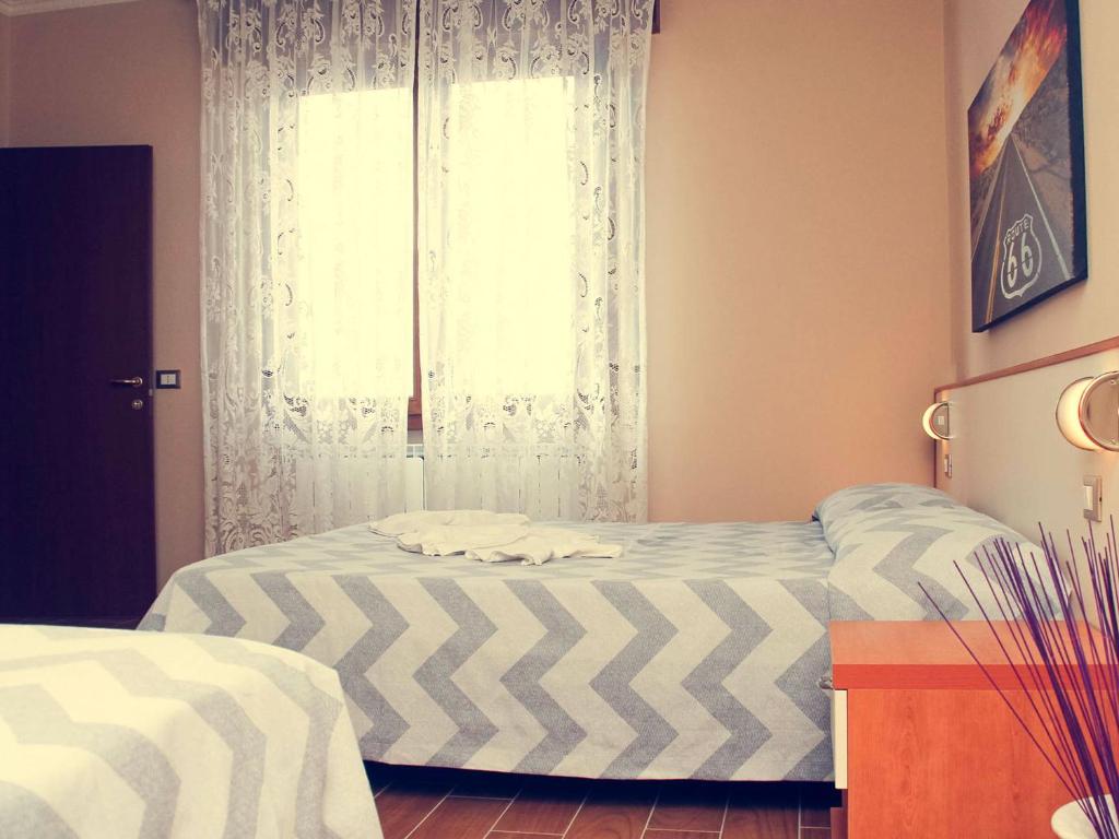 Postel nebo postele na pokoji v ubytování B&B Tina