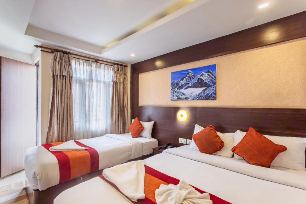 Postel nebo postele na pokoji v ubytování Hotel Sapana Garden Thamel