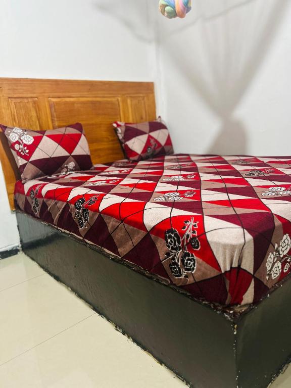 Postel nebo postele na pokoji v ubytování Tiny Homestay