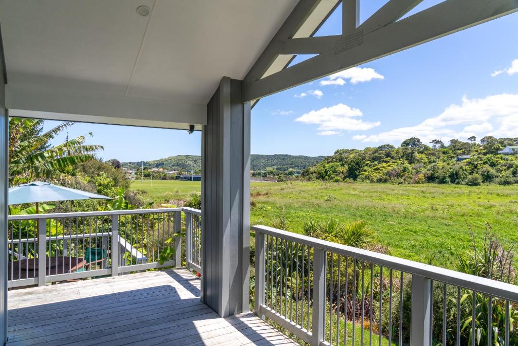 a view from the balcony of a house at Banana Bungalow Studio in Raglan