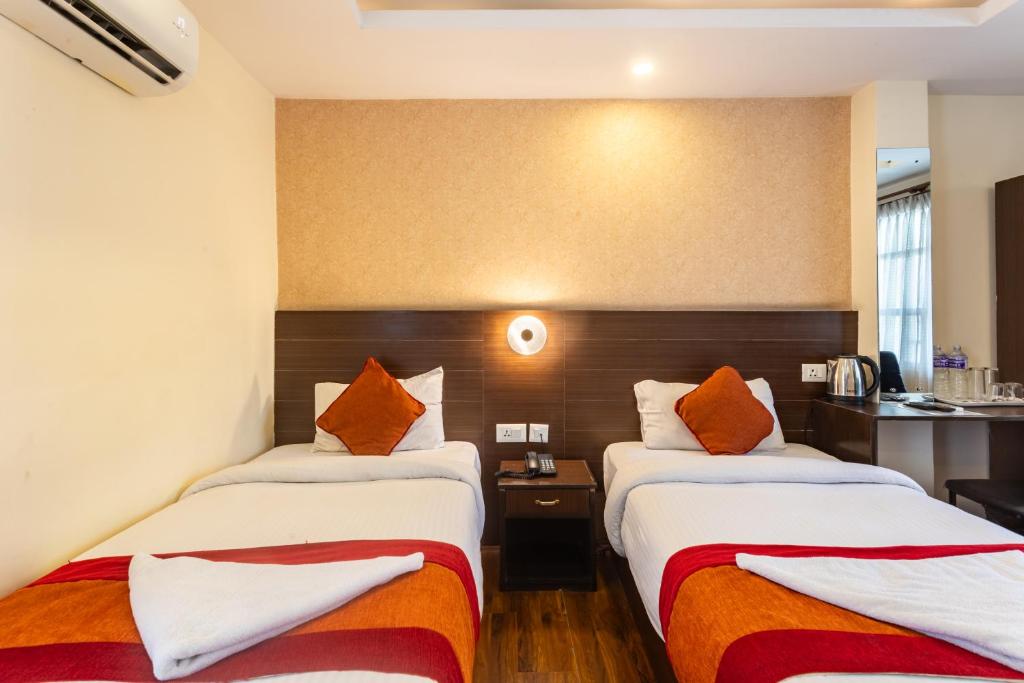 Postel nebo postele na pokoji v ubytování Hotel Sapana Garden Thamel