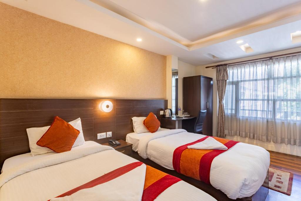 Postel nebo postele na pokoji v ubytování Hotel Sapana Garden Thamel