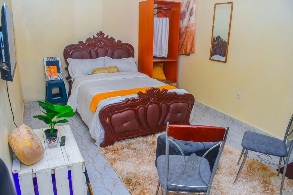 Postel nebo postele na pokoji v ubytování Marvel Homes