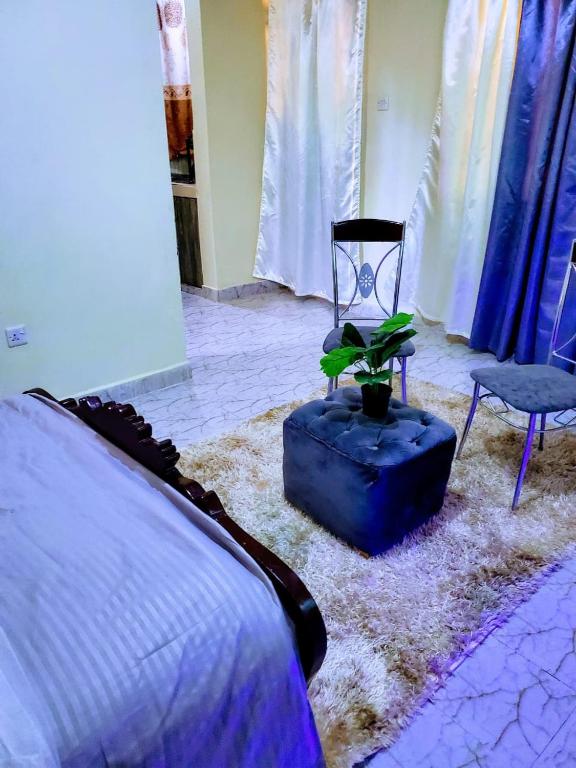 Postel nebo postele na pokoji v ubytování Marvel Homes