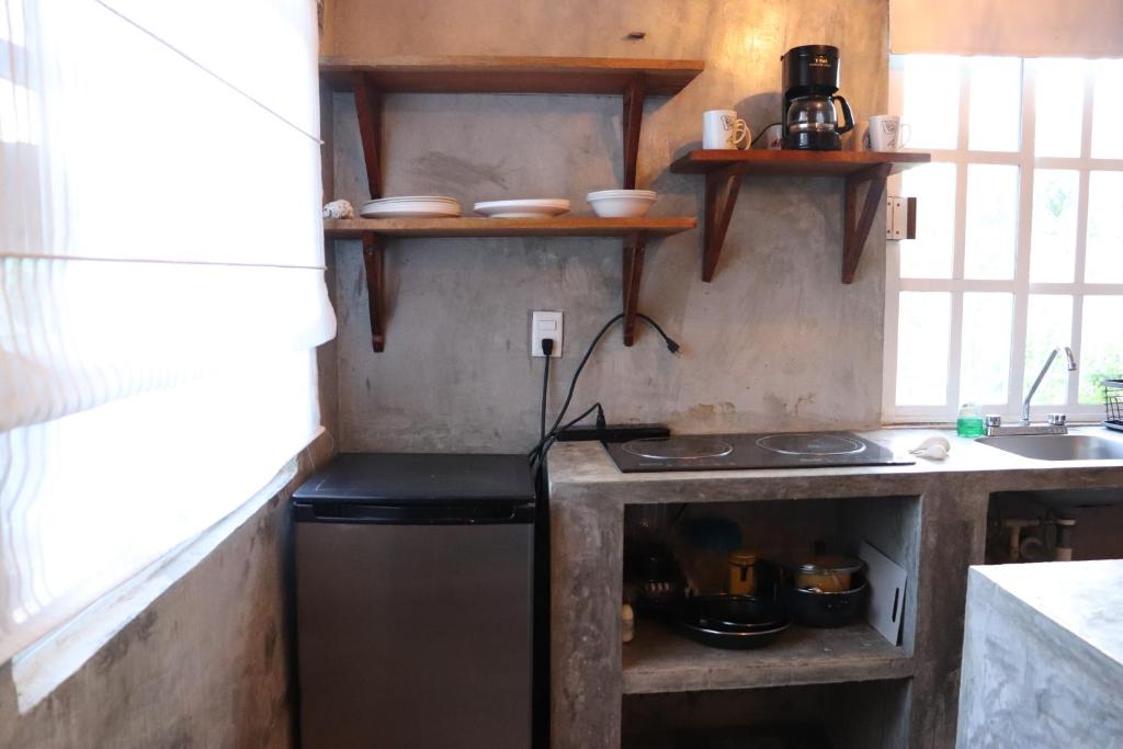 Kuchyň nebo kuchyňský kout v ubytování Casita Guayaba