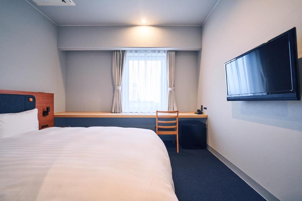 Postel nebo postele na pokoji v ubytování Hotel Global View Tsuchiura