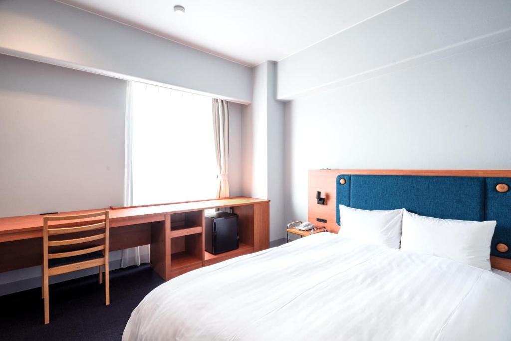 Postel nebo postele na pokoji v ubytování Hotel Global View Tsuchiura