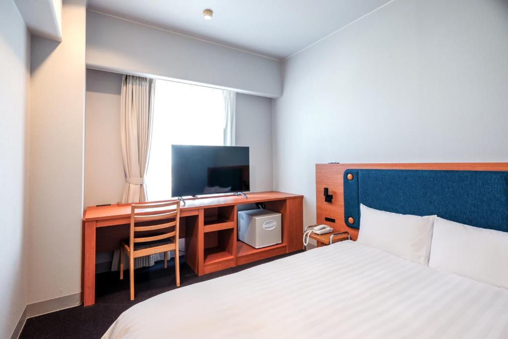 Postel nebo postele na pokoji v ubytování Hotel Global View Tsuchiura