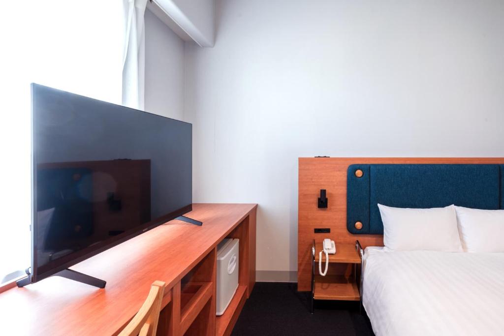 Postel nebo postele na pokoji v ubytování Hotel Global View Tsuchiura