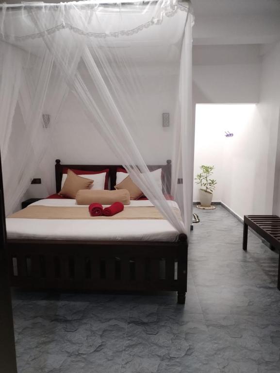 Postel nebo postele na pokoji v ubytování Ella Shali's home