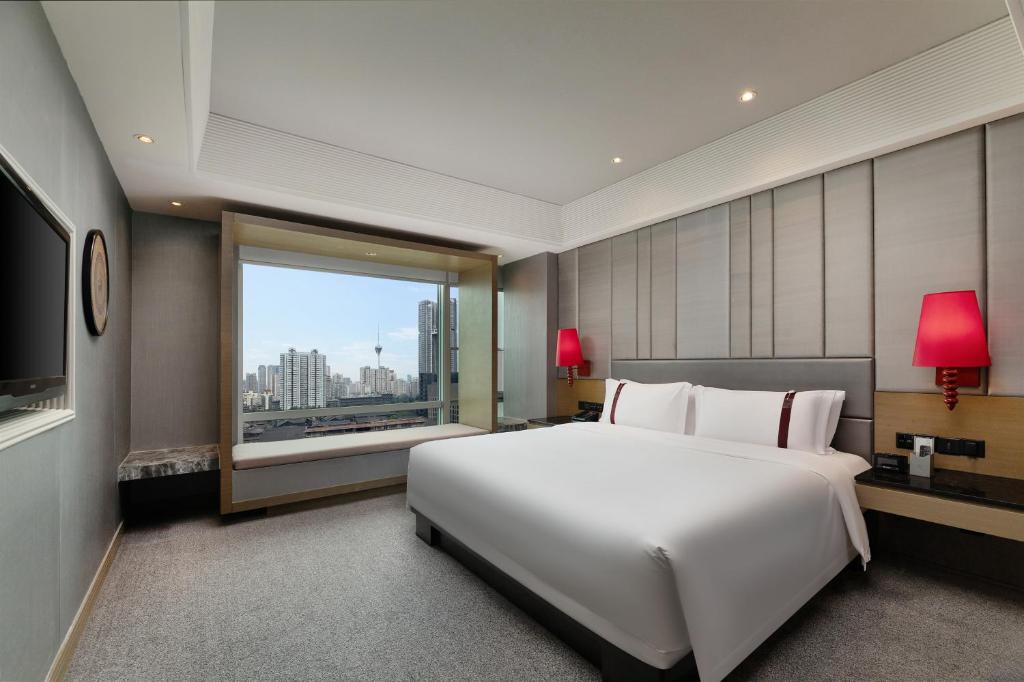 Postel nebo postele na pokoji v ubytování Rhombus Park Aura Chengdu Hotel