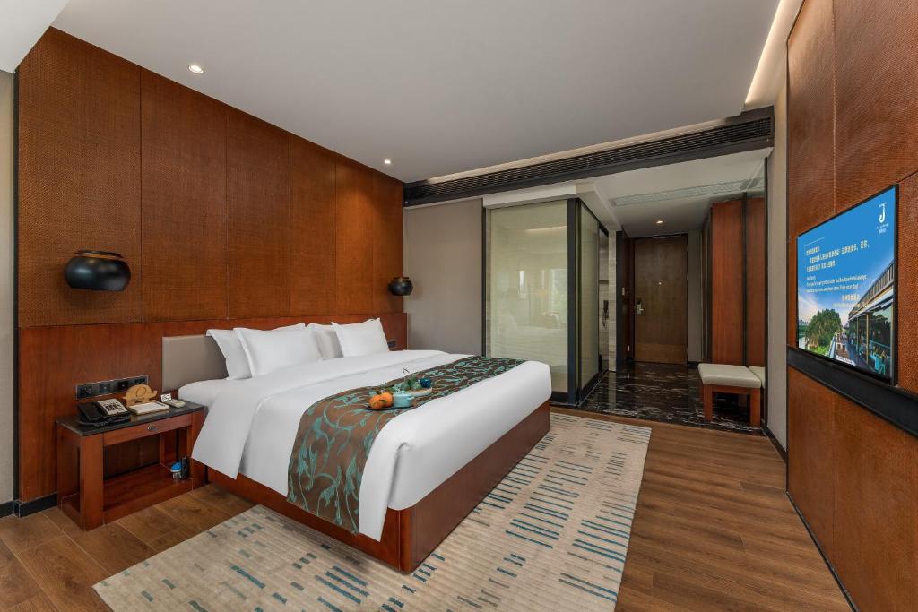 Postel nebo postele na pokoji v ubytování Jolie Vue Boutique Hotel Guilin (near Elephant Trunk Hill)
