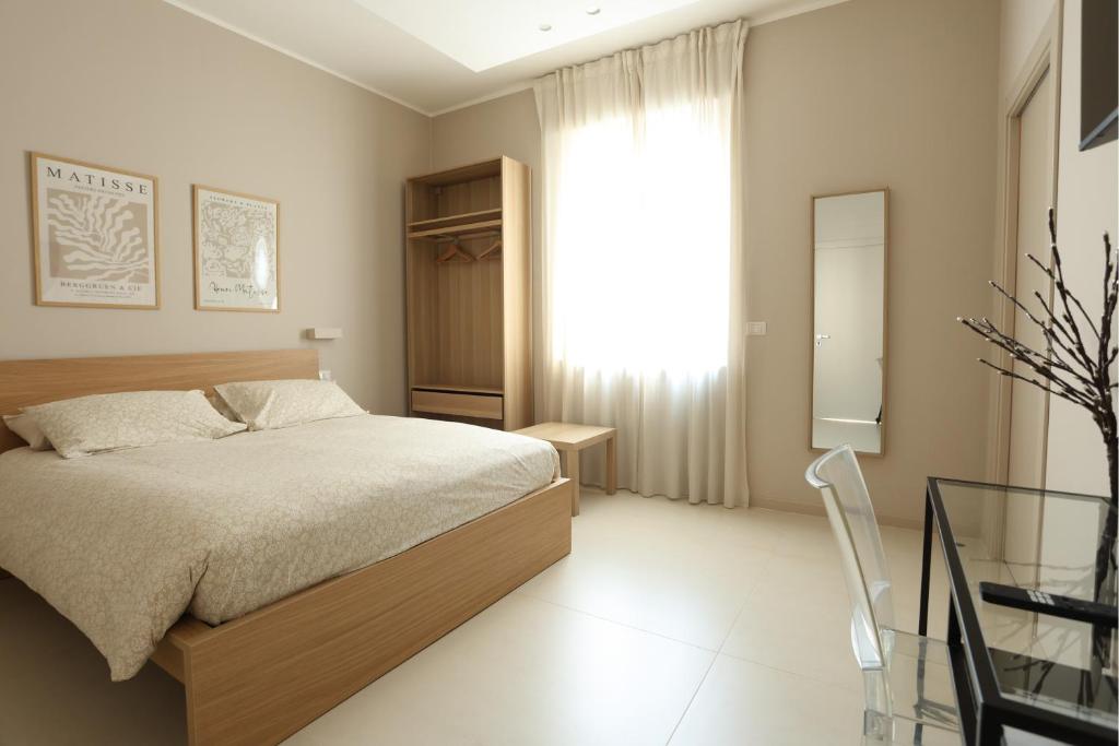 Postel nebo postele na pokoji v ubytování B&B Il Rifugio Urbano