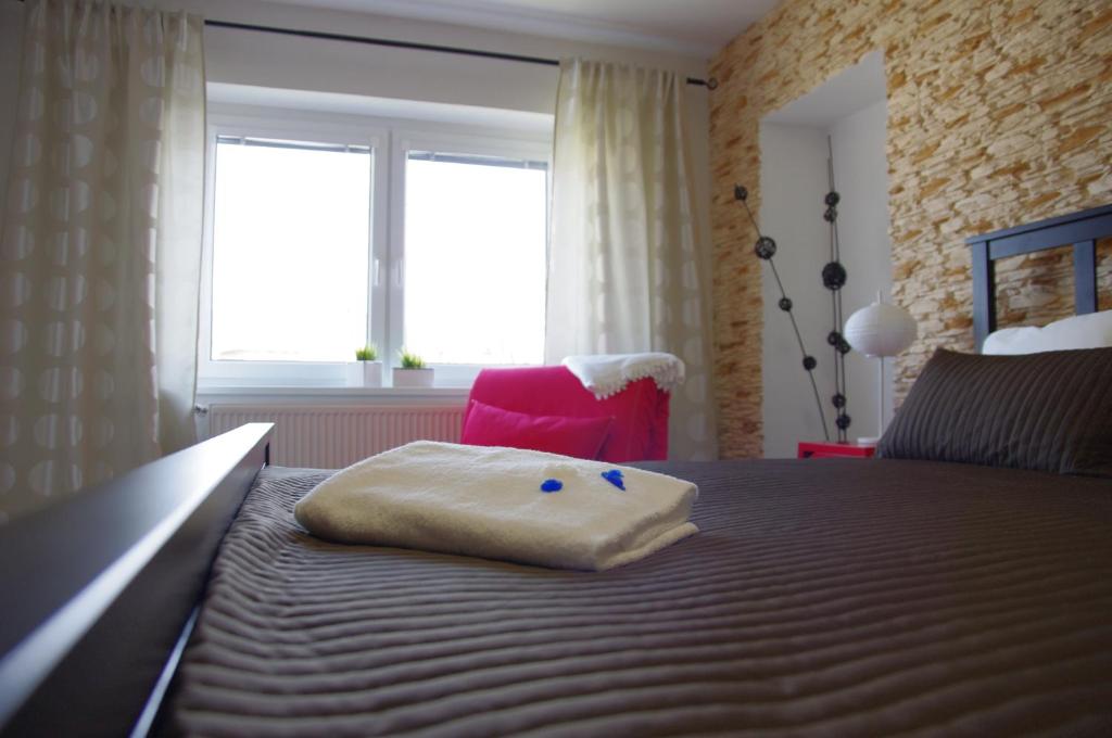 Postel nebo postele na pokoji v ubytování Apartments Centrum