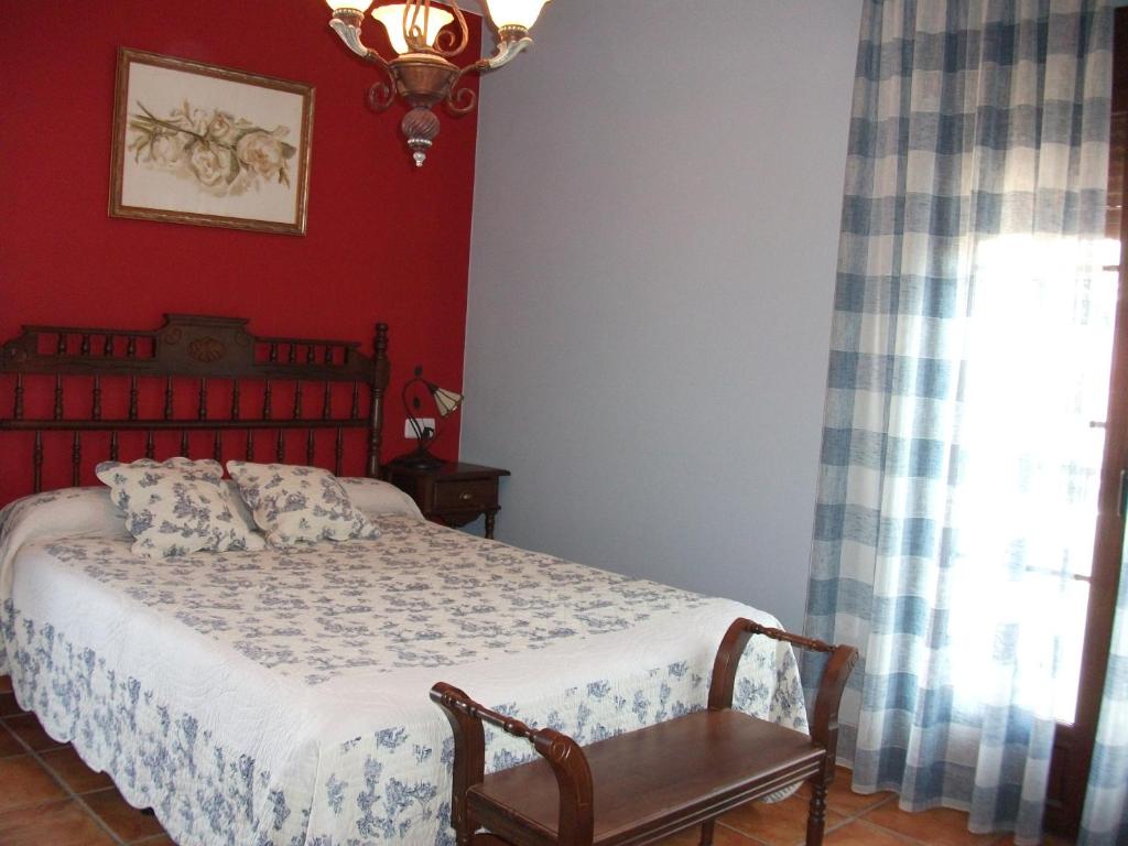 Postel nebo postele na pokoji v ubytování Hotel Los Rebites