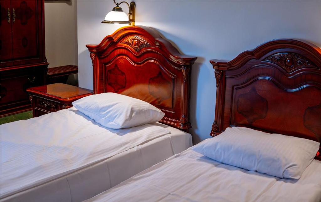 Posteľ alebo postele v izbe v ubytovaní Hotel Górski