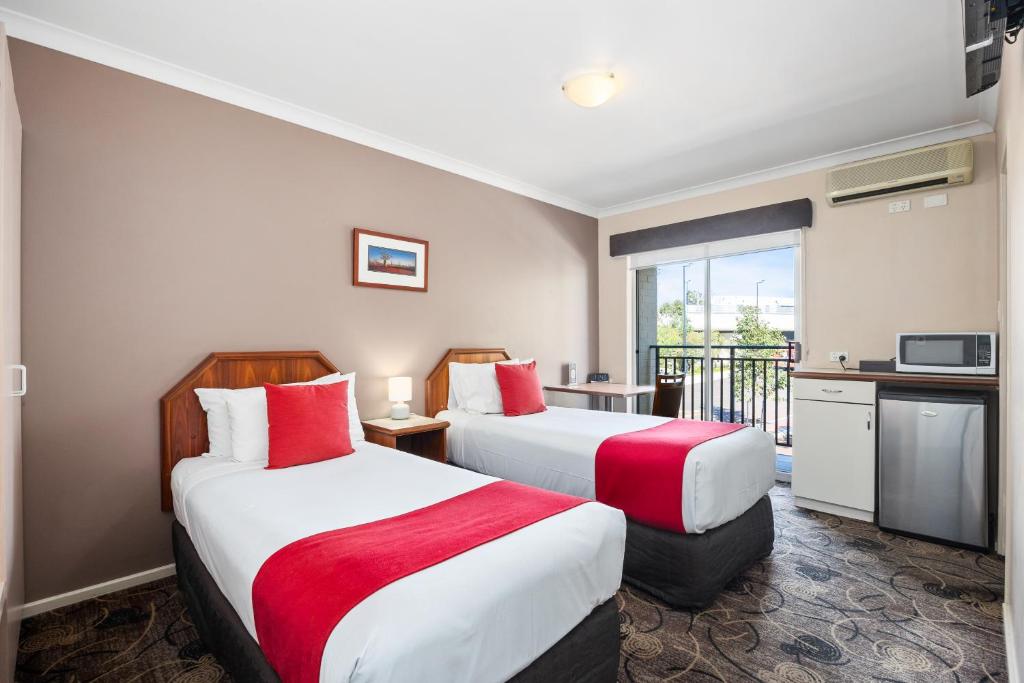 Postel nebo postele na pokoji v ubytování Quality Hotel Bayswater