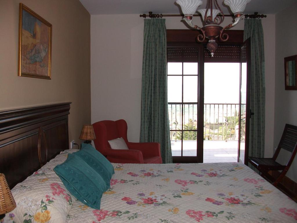 Postel nebo postele na pokoji v ubytování Hotel Los Rebites