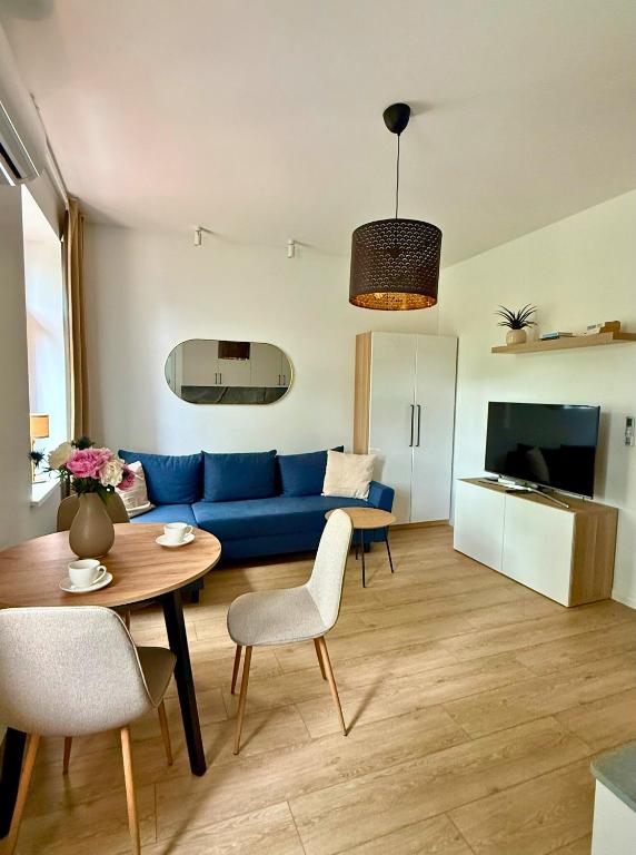 Televízia a/alebo spoločenská miestnosť v ubytovaní Apartamenty Izerskie - ul. Wczasowa 8