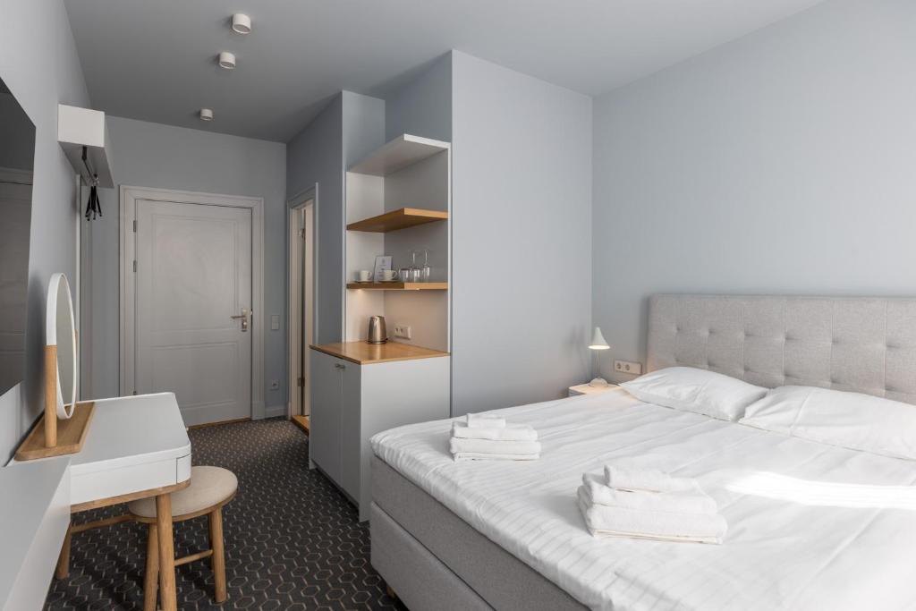 Postel nebo postele na pokoji v ubytování Roze Park Rooms