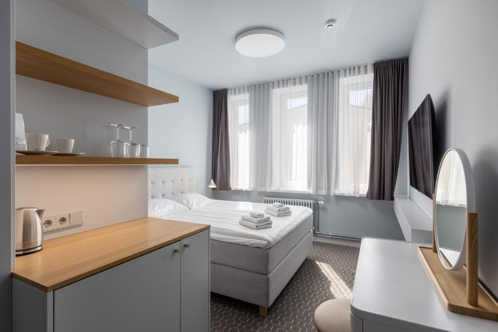 Postel nebo postele na pokoji v ubytování Roze Park Rooms