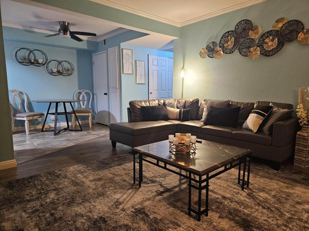 a living room with a couch and a coffee table at Affordable 2br-2ba Condo - Extra Amenities in Las Vegas