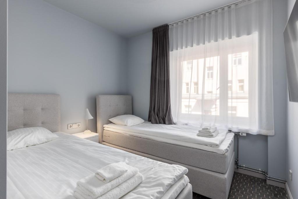 Postel nebo postele na pokoji v ubytování Roze Park Rooms
