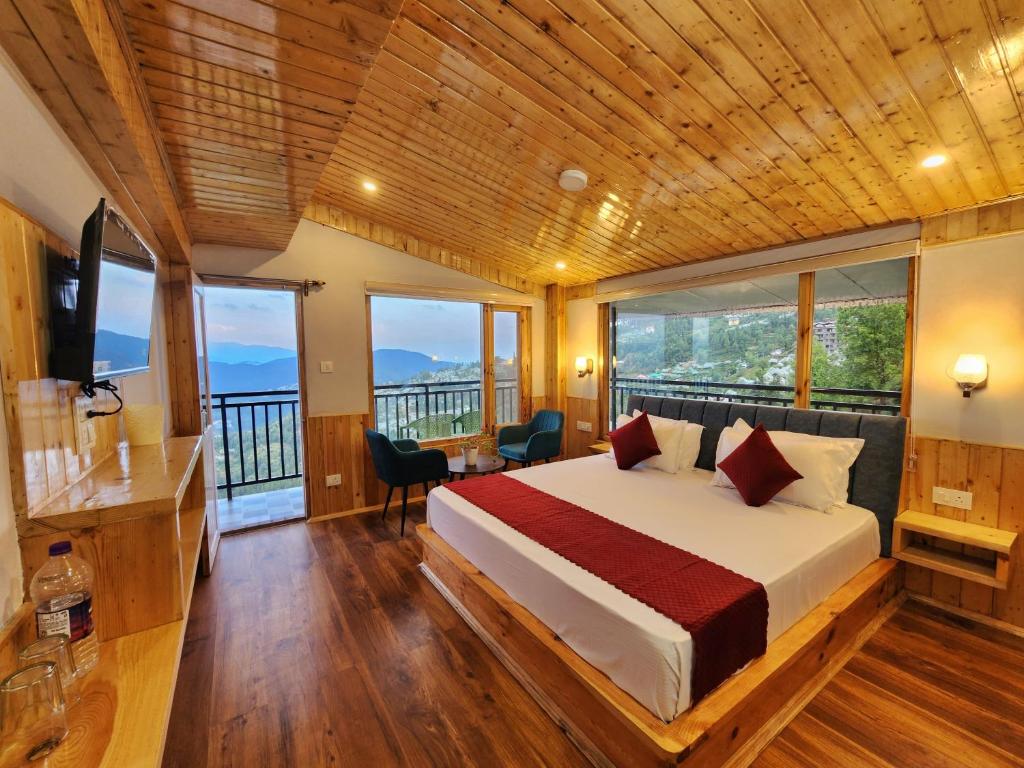 Ένα ή περισσότερα κρεβάτια σε δωμάτιο στο The Kufri House