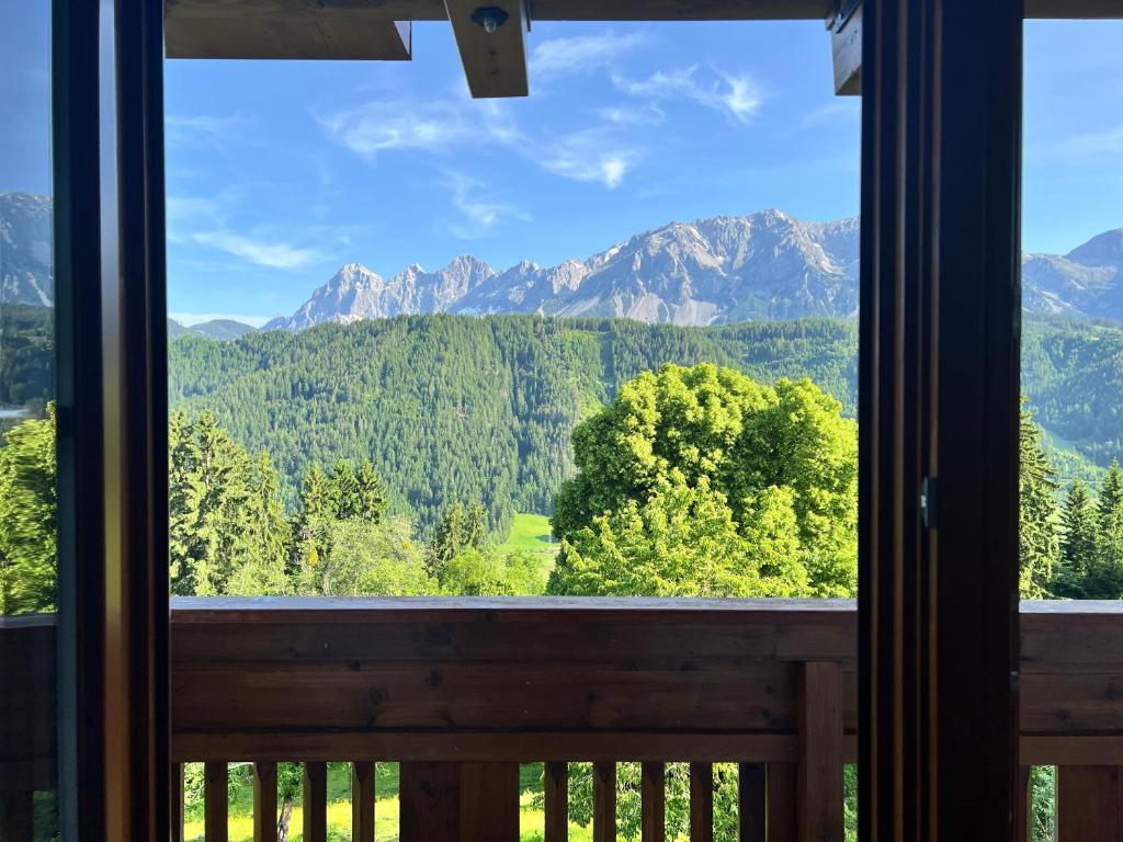 a view from a window of a mountain range at VOM REITER, Ferienwohnung am Bauernhof mit Bergblick und privater Infrarotkabine, Inklusive Sommercard in Schladming